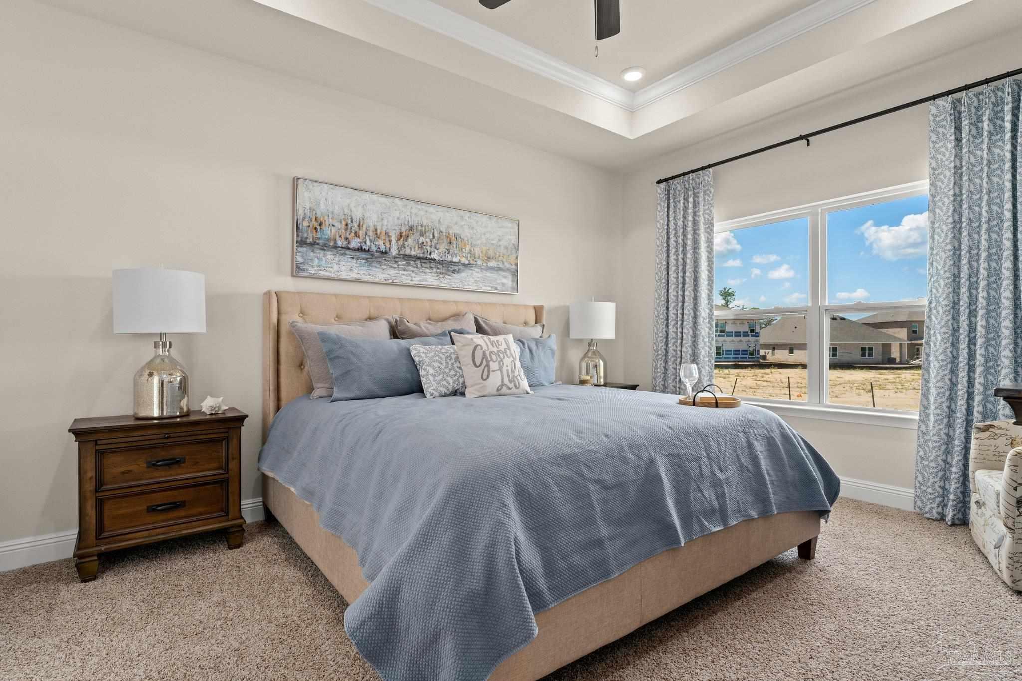 4946 Snipe Road Pace, FL 32571 - Photo 23 of 27 a bed sitting in a bedroom next to a window