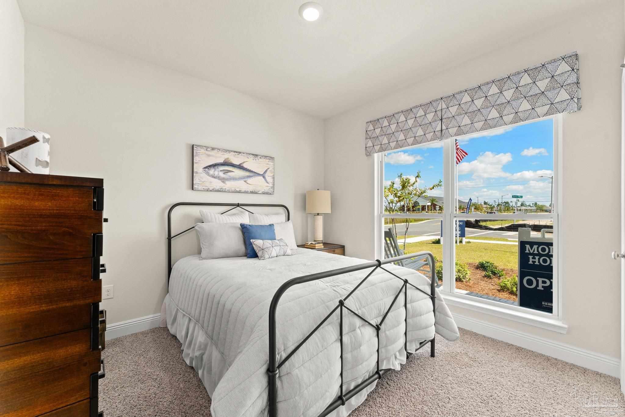 4946 Snipe Road Pace, FL 32571 - Photo 3 of 27 a bedroom with a large bed and a window