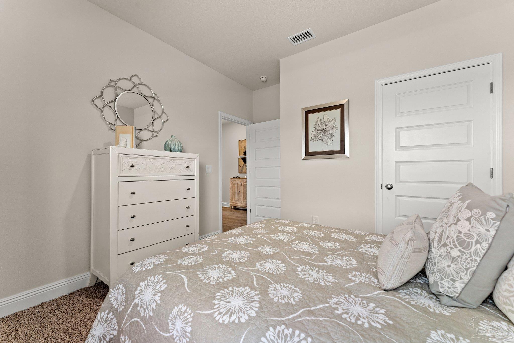 4946 Snipe Road Pace, FL 32571 - Photo 8 of 27 a bedroom with a bed and closet