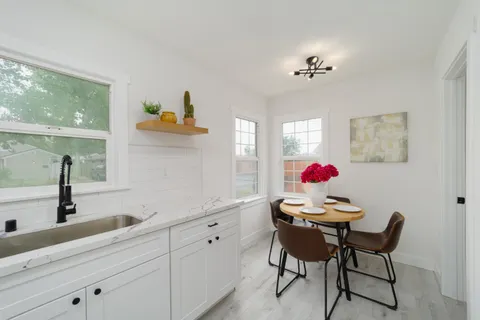 a view of dining room with furniture and chandelier