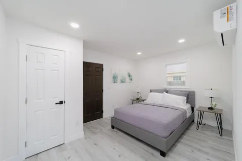 a bedroom with a bed and a table