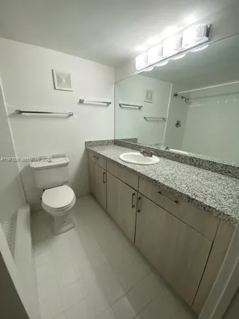 a bathroom with a shower and toilet