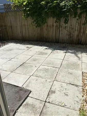 a view of a street with an outdoor space