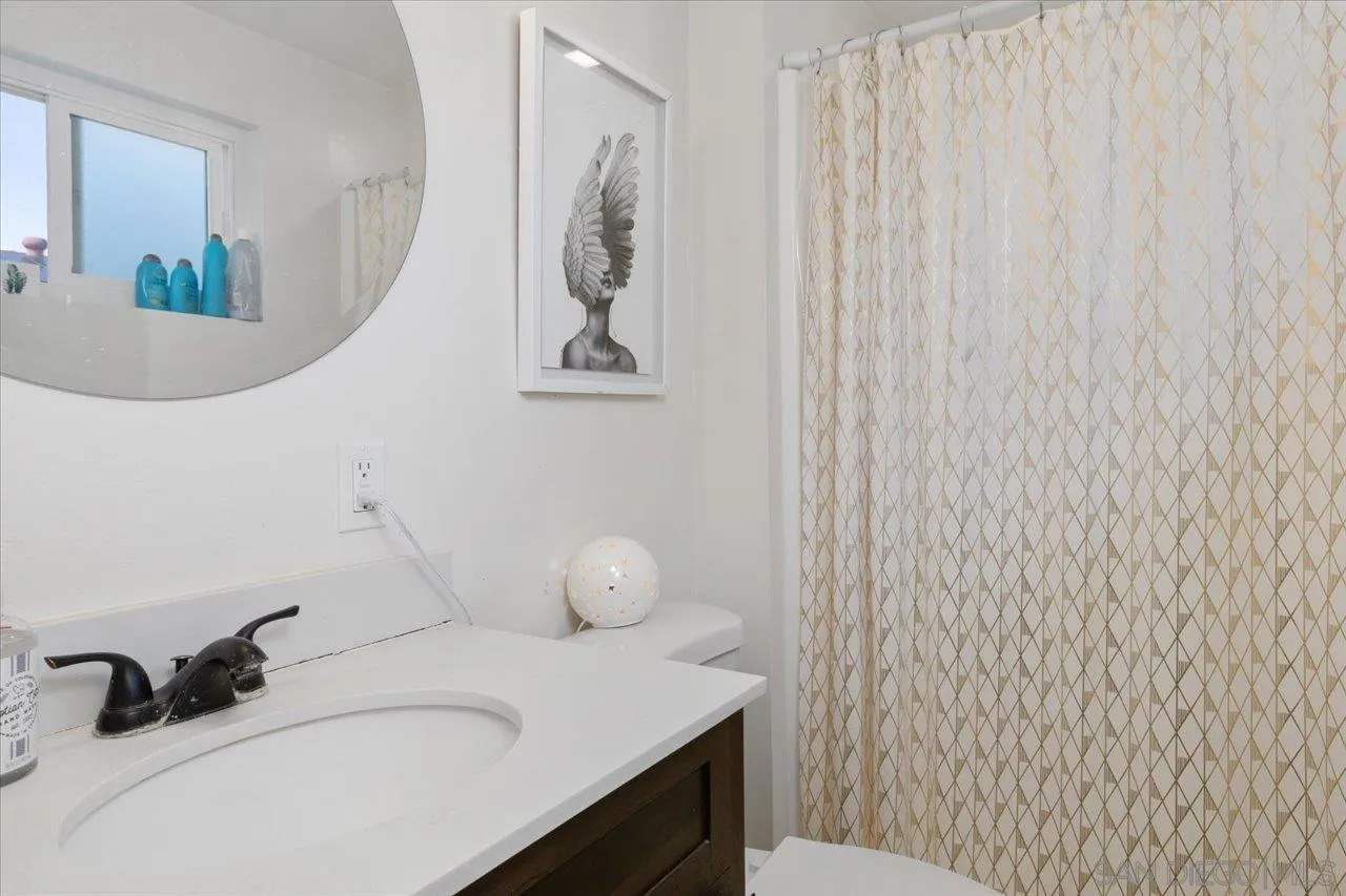 13433 Utopia Road Poway, CA 92064 - Photo 17 of 23 a bathroom with a sink and a mirror