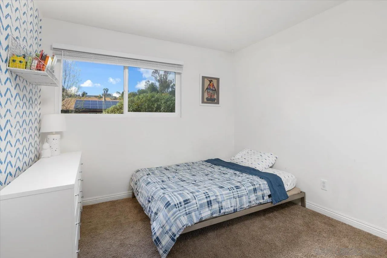 13433 Utopia Road Poway, CA 92064 - Photo 19 of 23 a bedroom with a bed and a window