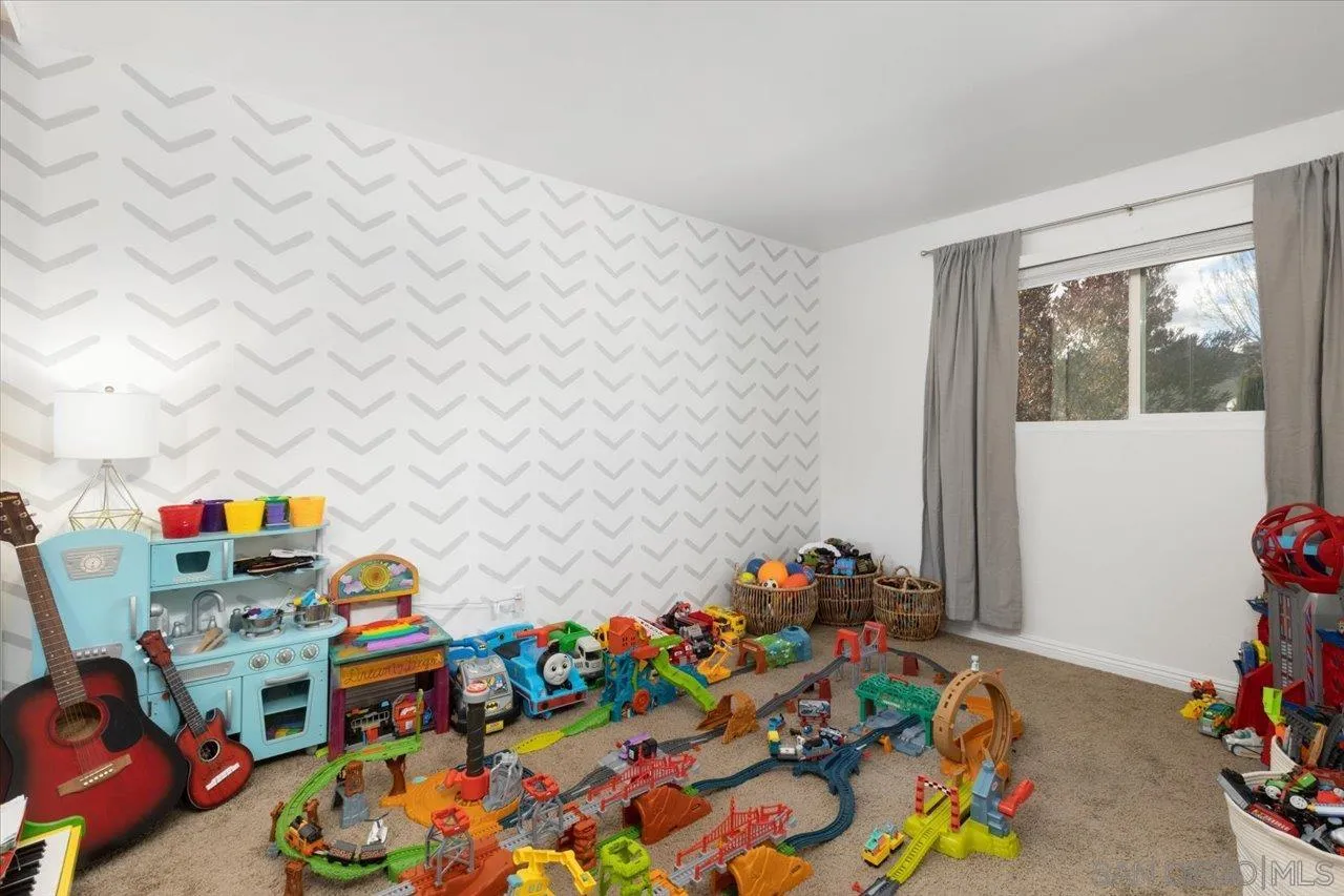 13433 Utopia Road Poway, CA 92064 - Photo 21 of 23 a room with toys and a baby crib