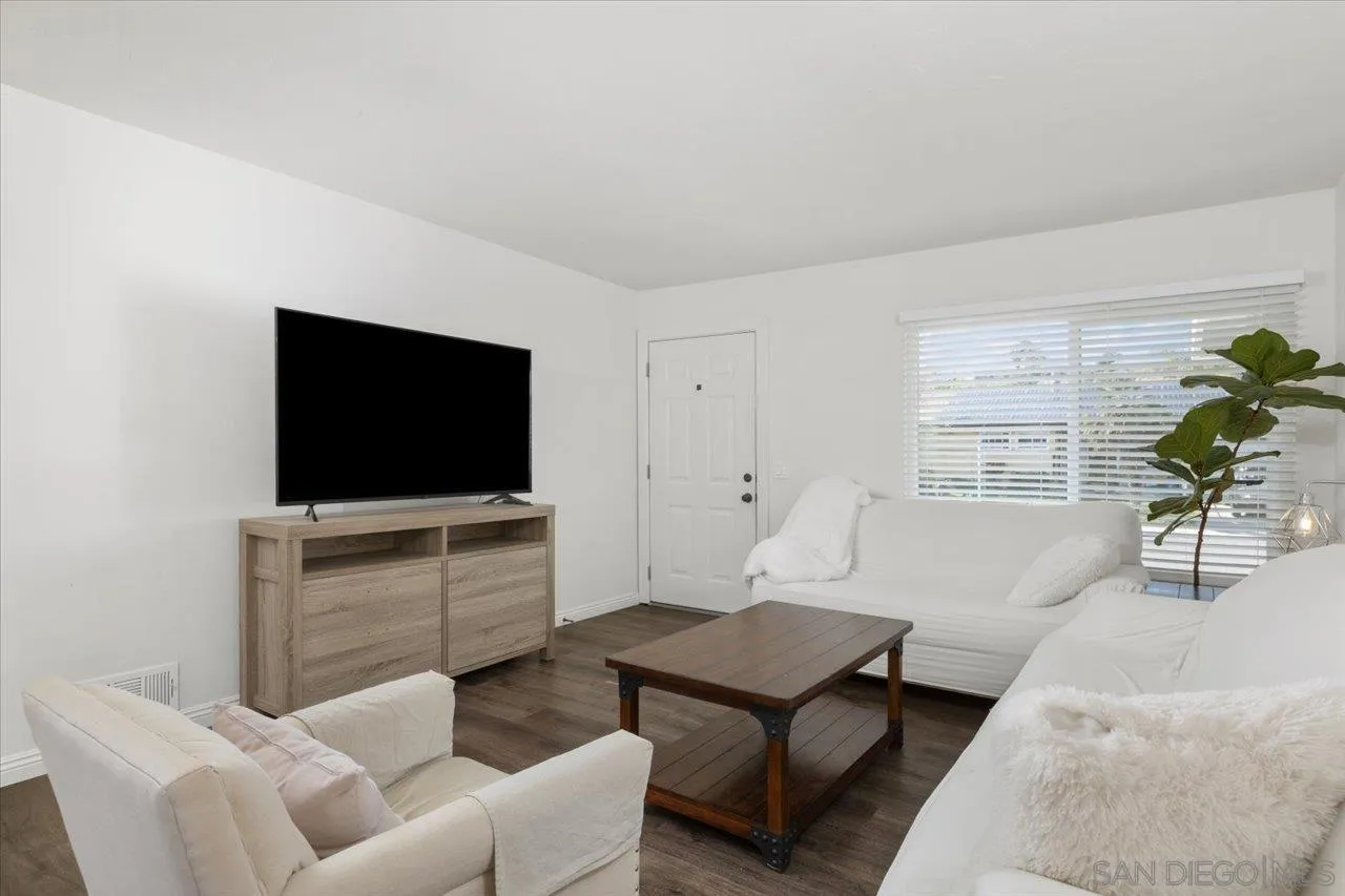 13433 Utopia Road Poway, CA 92064 - Photo 8 of 23 a living room with furniture and a flat screen tv