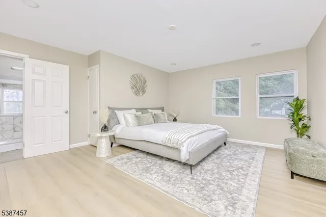 a bedroom with a large bed and a couch