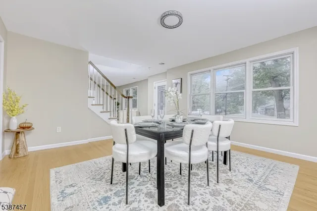 a view of a dining room with furniture and a table
