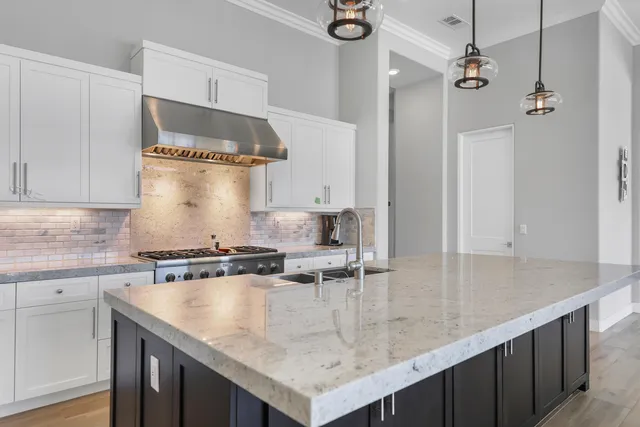 a spacious bedroom with a bed and a table in it