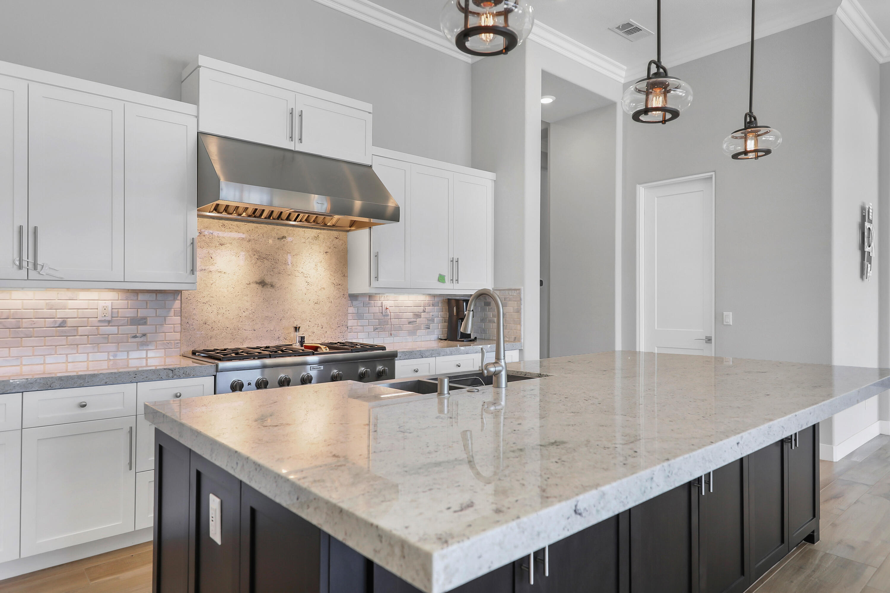 81-675 Thunder Gulch Way La Quinta, CA 92253 - Photo 13 of 61 a kitchen with stainless steel appliances granite countertop a sink a stove and a refrigerator