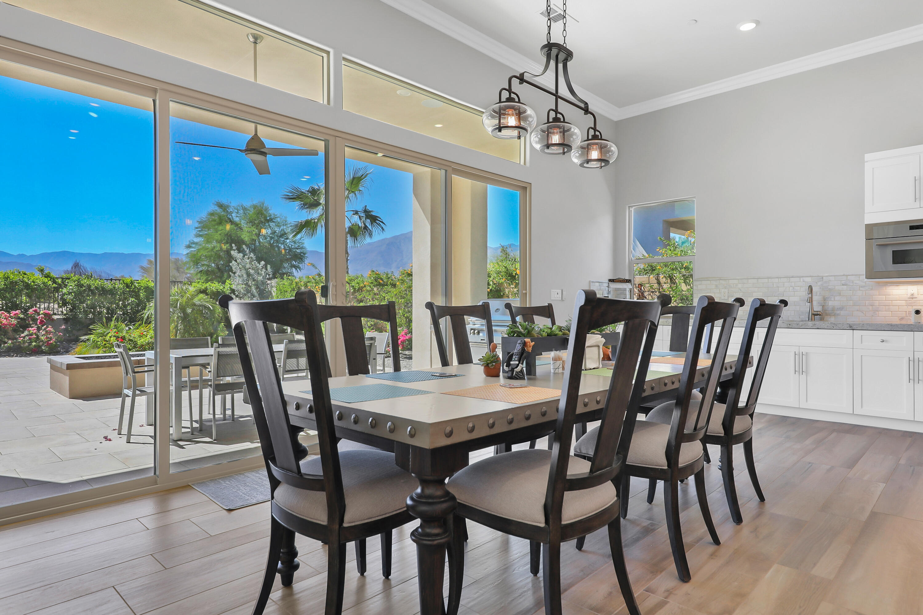 81-675 Thunder Gulch Way La Quinta, CA 92253 - Photo 16 of 61 a view of a dining room with furniture window and wooden floor