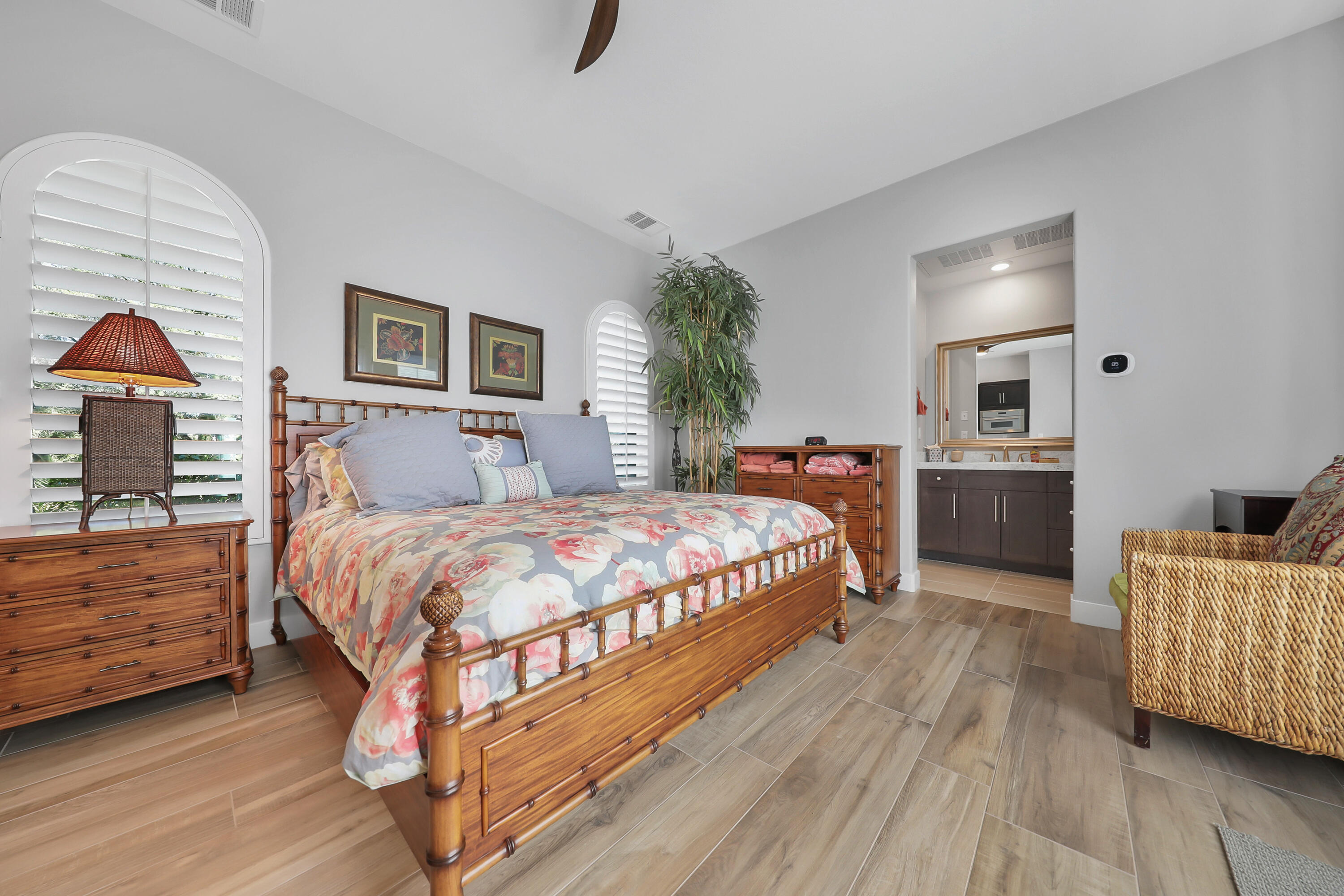 81-675 Thunder Gulch Way La Quinta, CA 92253 - Photo 33 of 61 a bedroom with a bed and wooden floor