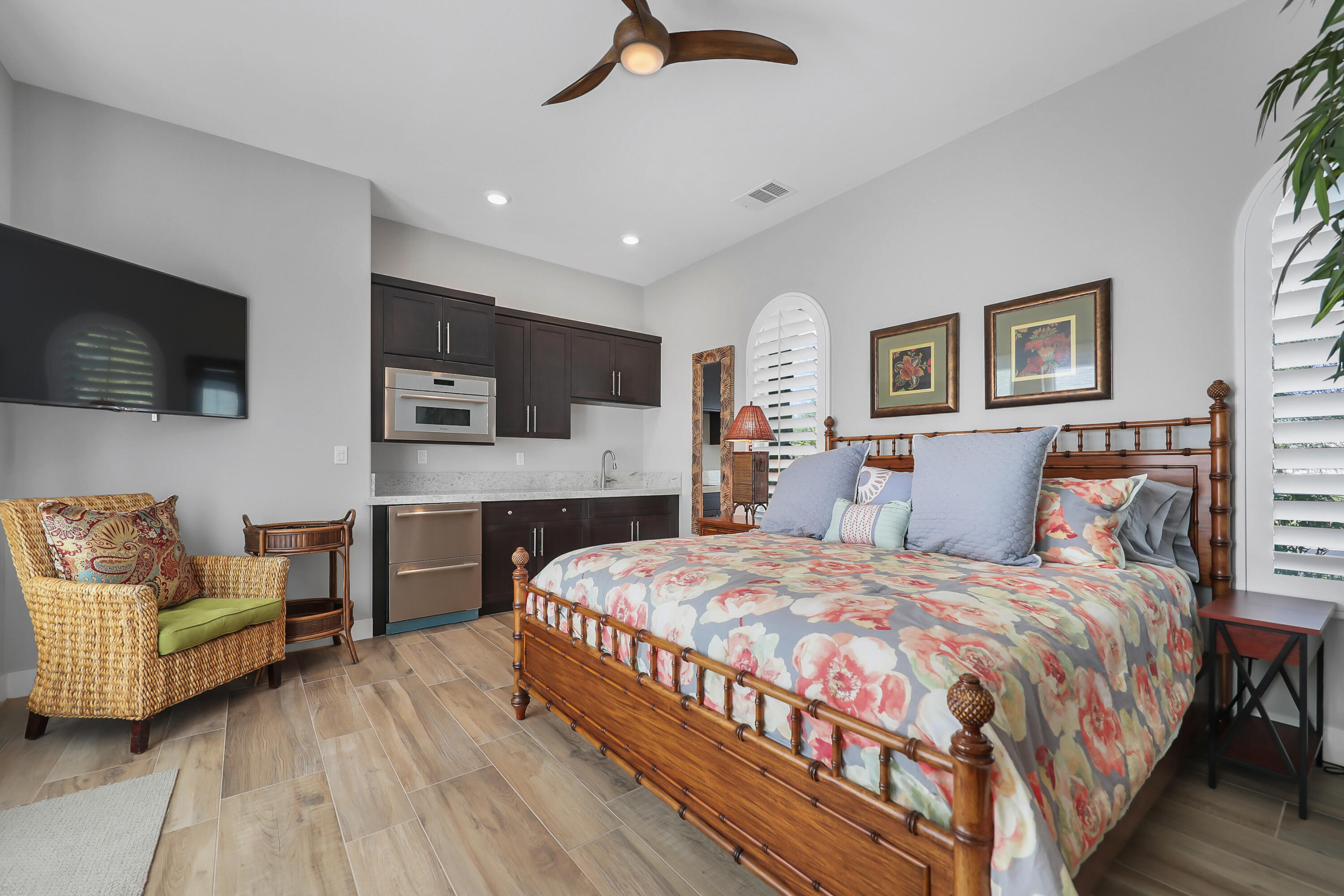 81-675 Thunder Gulch Way La Quinta, CA 92253 - Photo 34 of 61 a bedroom with a bed couch and a flat screen tv