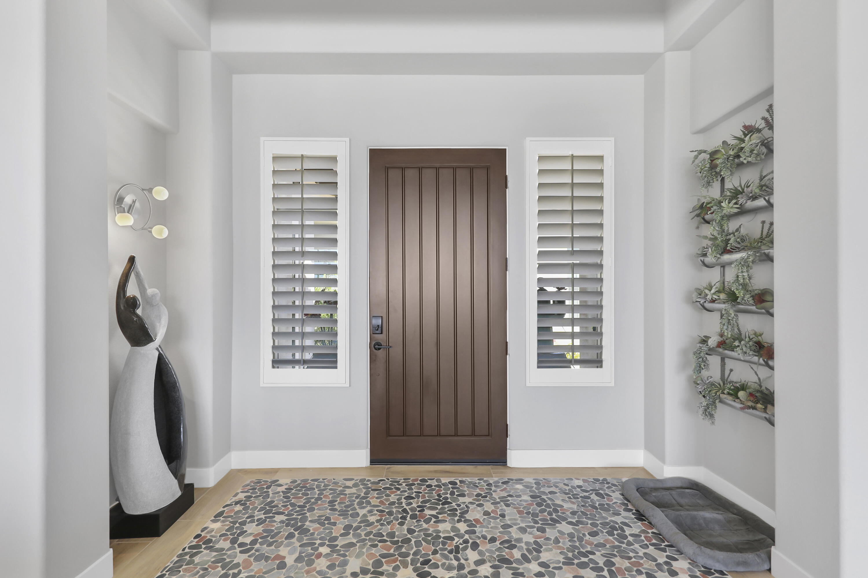 81-675 Thunder Gulch Way La Quinta, CA 92253 - Photo 4 of 61 a view of entryway with a rug and wooden floor