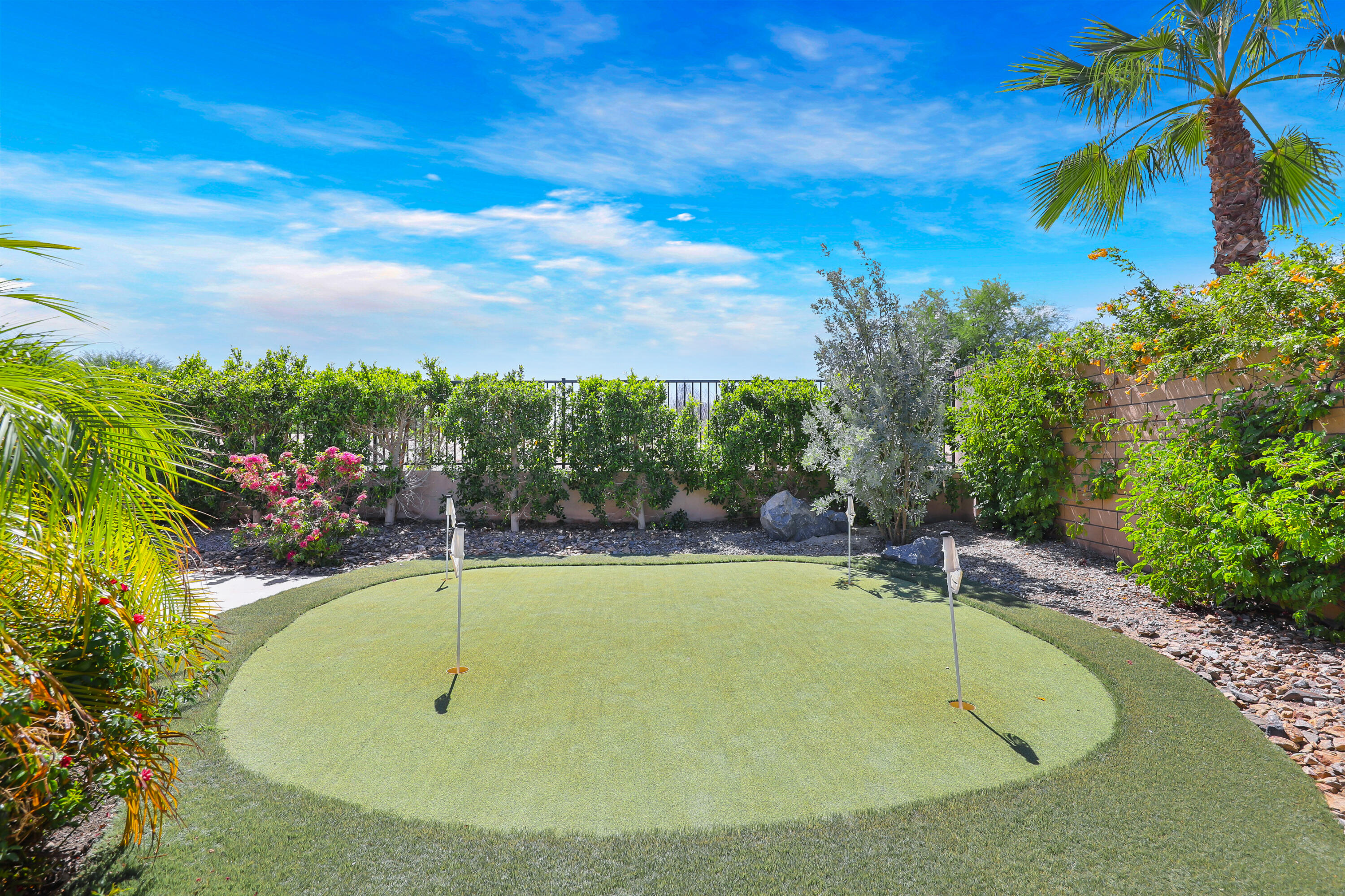 81-675 Thunder Gulch Way La Quinta, CA 92253 - Photo 47 of 61 a view of a swimming pool and lounge chair
