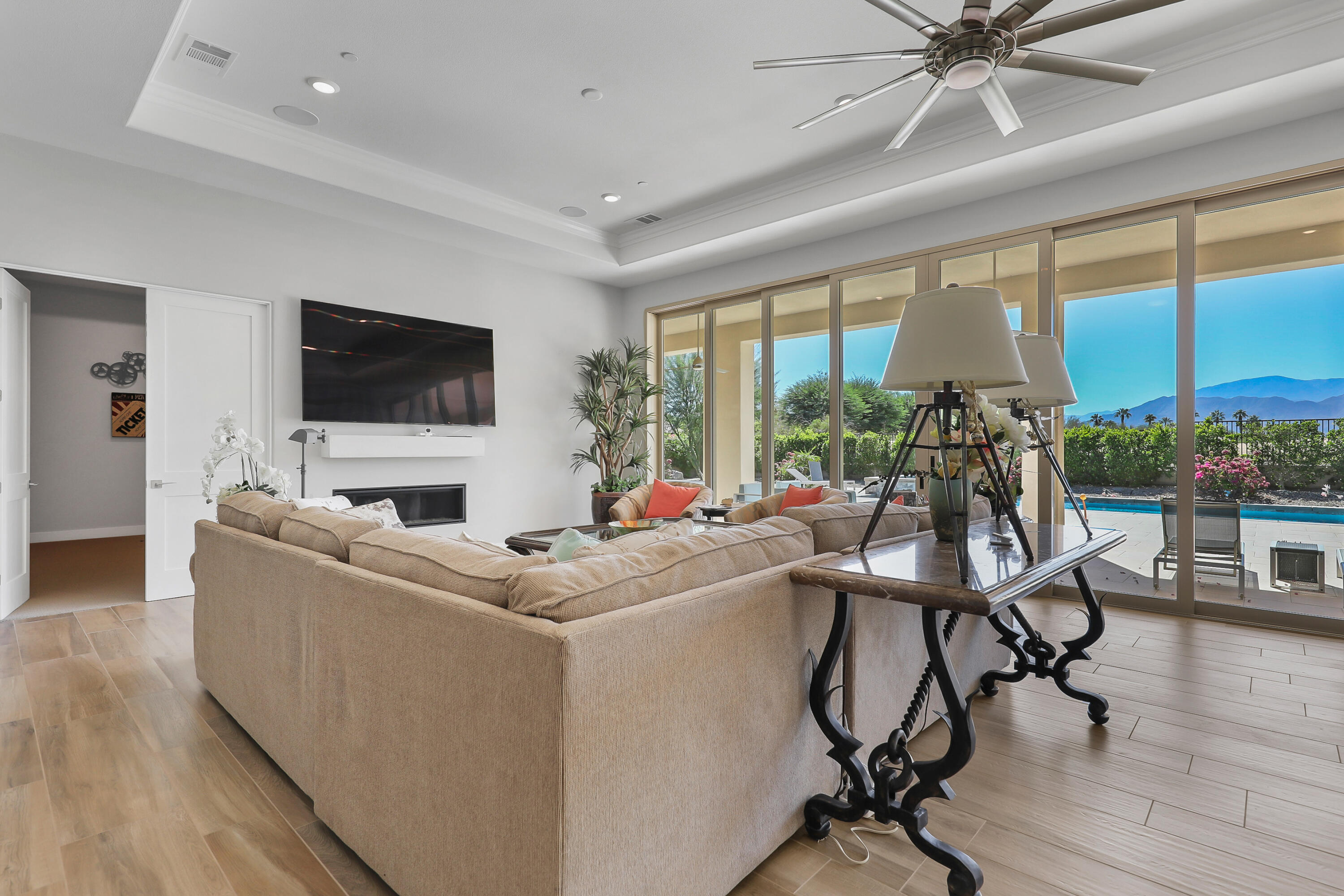 81-675 Thunder Gulch Way La Quinta, CA 92253 - Photo 5 of 61 a living room with furniture and a flat screen tv