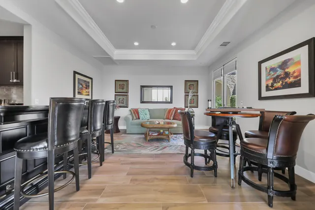 a view of a dining room with furniture window and wooden floor