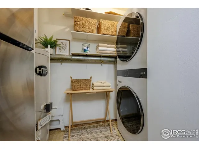 a view of a kitchen with a sink and a washer