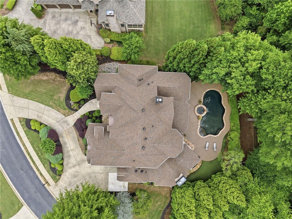 8340 Colonial Place Duluth, GA 30097 - Photo 63 of 74 an aerial view of a house with garden space and swimming pool