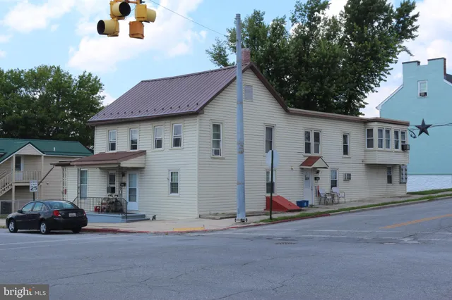 a view of a car park front of house