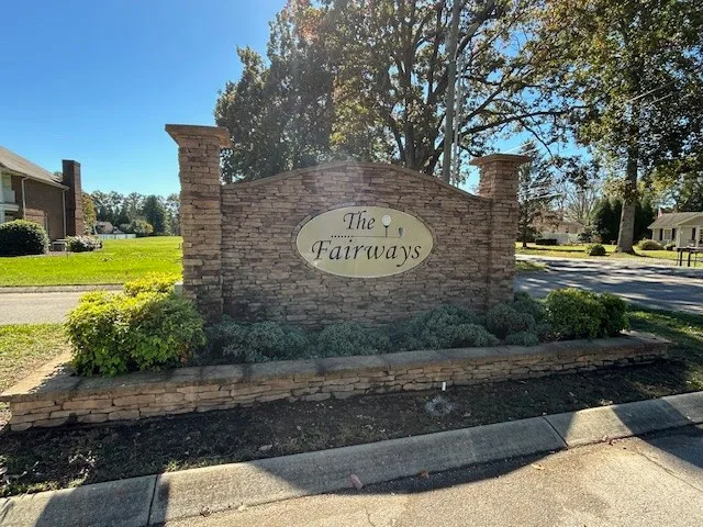 a view of a park with welcome board