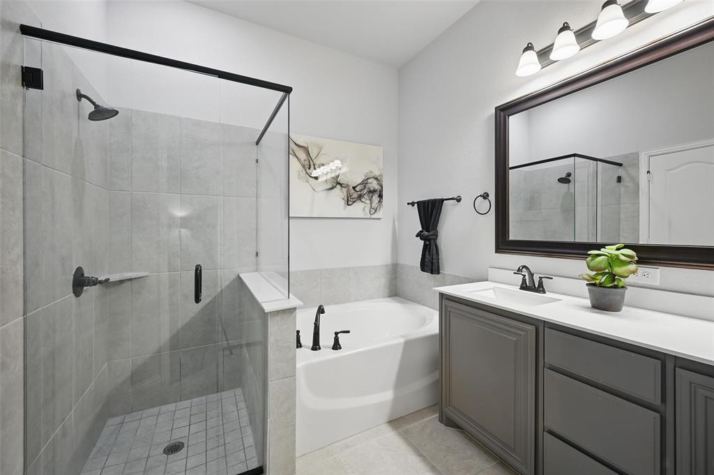 625 Ridgewater Trail Fort Worth, TX 76131 - Photo 13 of 27 Full bathroom with tile patterned flooring, a bath, a shower stall, and vanity