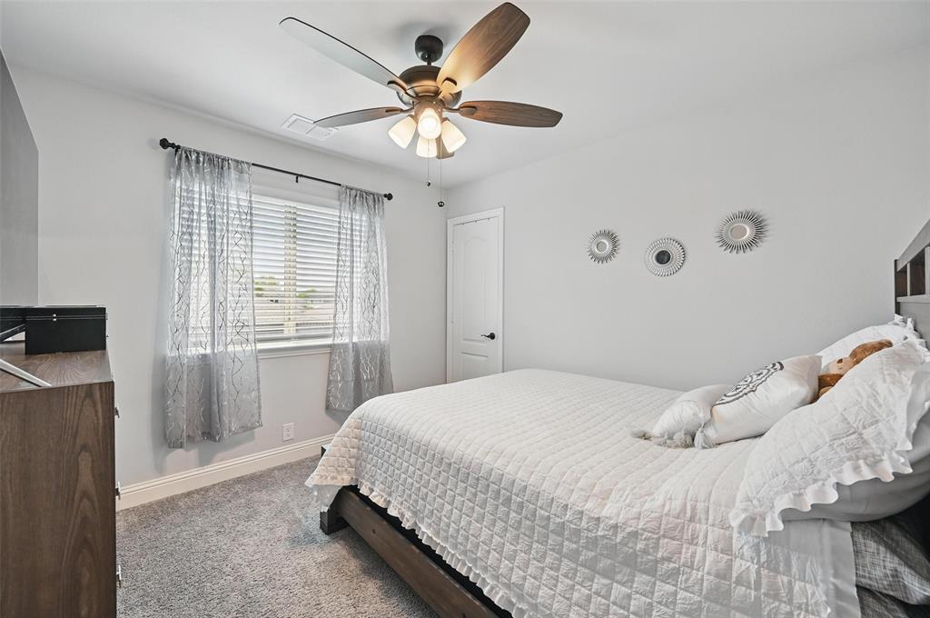 625 Ridgewater Trail Fort Worth, TX 76131 - Photo 14 of 27 Carpeted bedroom with visible vents, baseboards, and ceiling fan