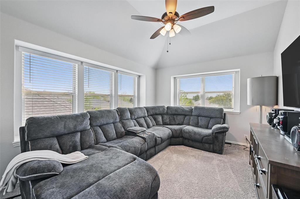 625 Ridgewater Trail Fort Worth, TX 76131 - Photo 20 of 27 Living area with ceiling fan, baseboards, carpet, and lofted ceiling