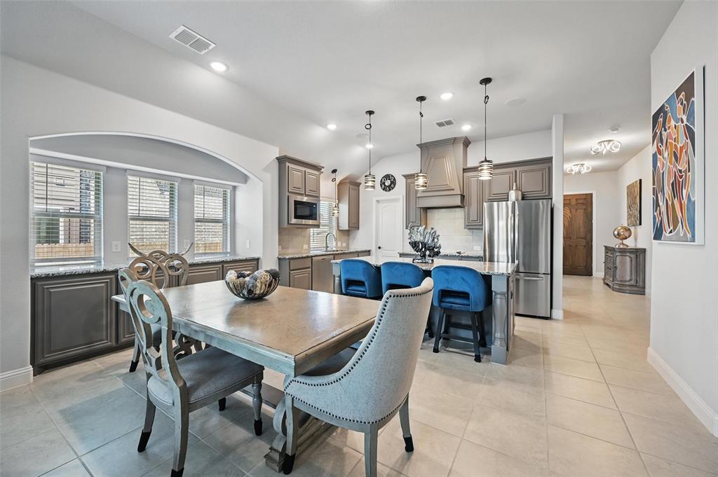 625 Ridgewater Trail Fort Worth, TX 76131 - Photo 2 of 27 Dining room featuring visible vents, recessed lighting, light tile patterned floors, and lofted ceiling