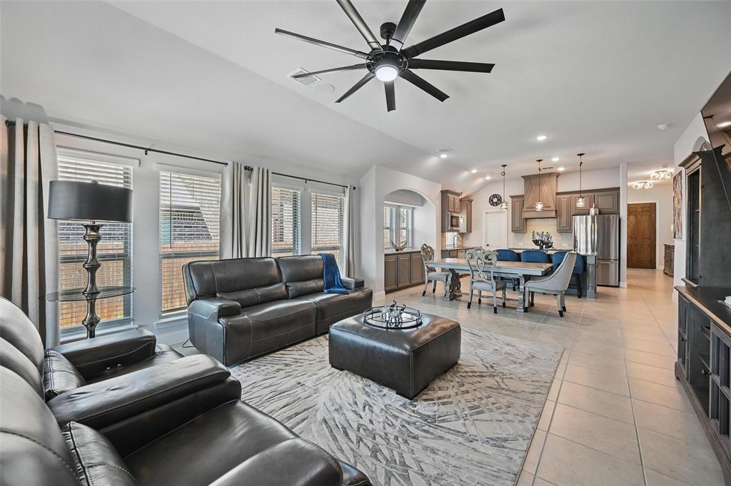 625 Ridgewater Trail Fort Worth, TX 76131 - Photo 7 of 27 Living area featuring arched walkways, a ceiling fan, recessed lighting, vaulted ceiling, and light tile patterned flooring