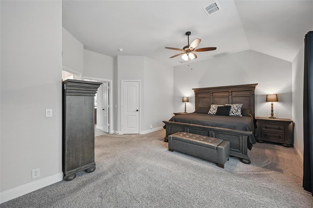 625 Ridgewater Trail Fort Worth, TX 76131 - Photo 10 of 27 Bedroom with visible vents, baseboards, carpet floors, and lofted ceiling