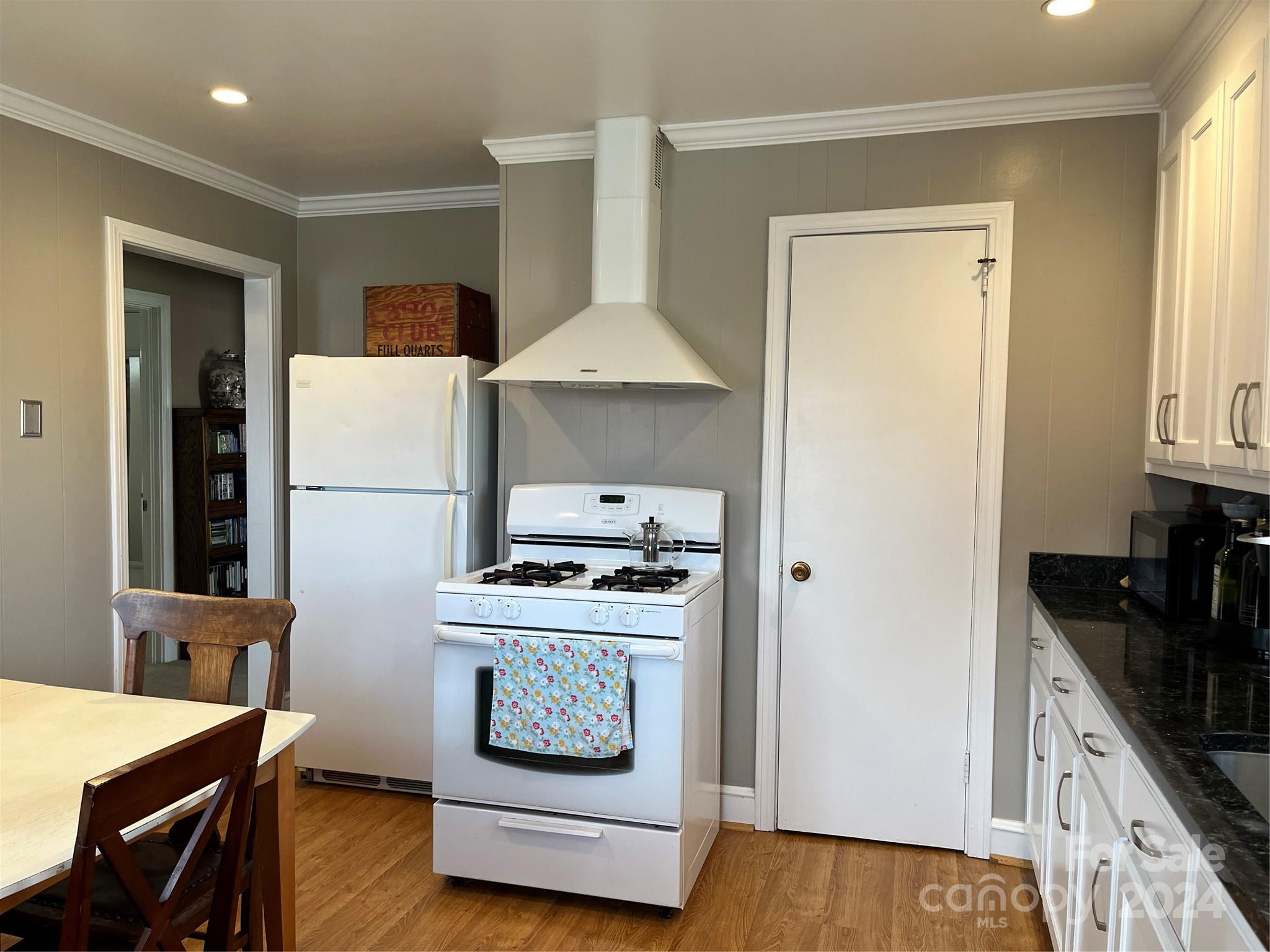 108 North Street Morganton, NC 28655 - Photo 5 of 12 a kitchen with a stove a refrigerator and a stove