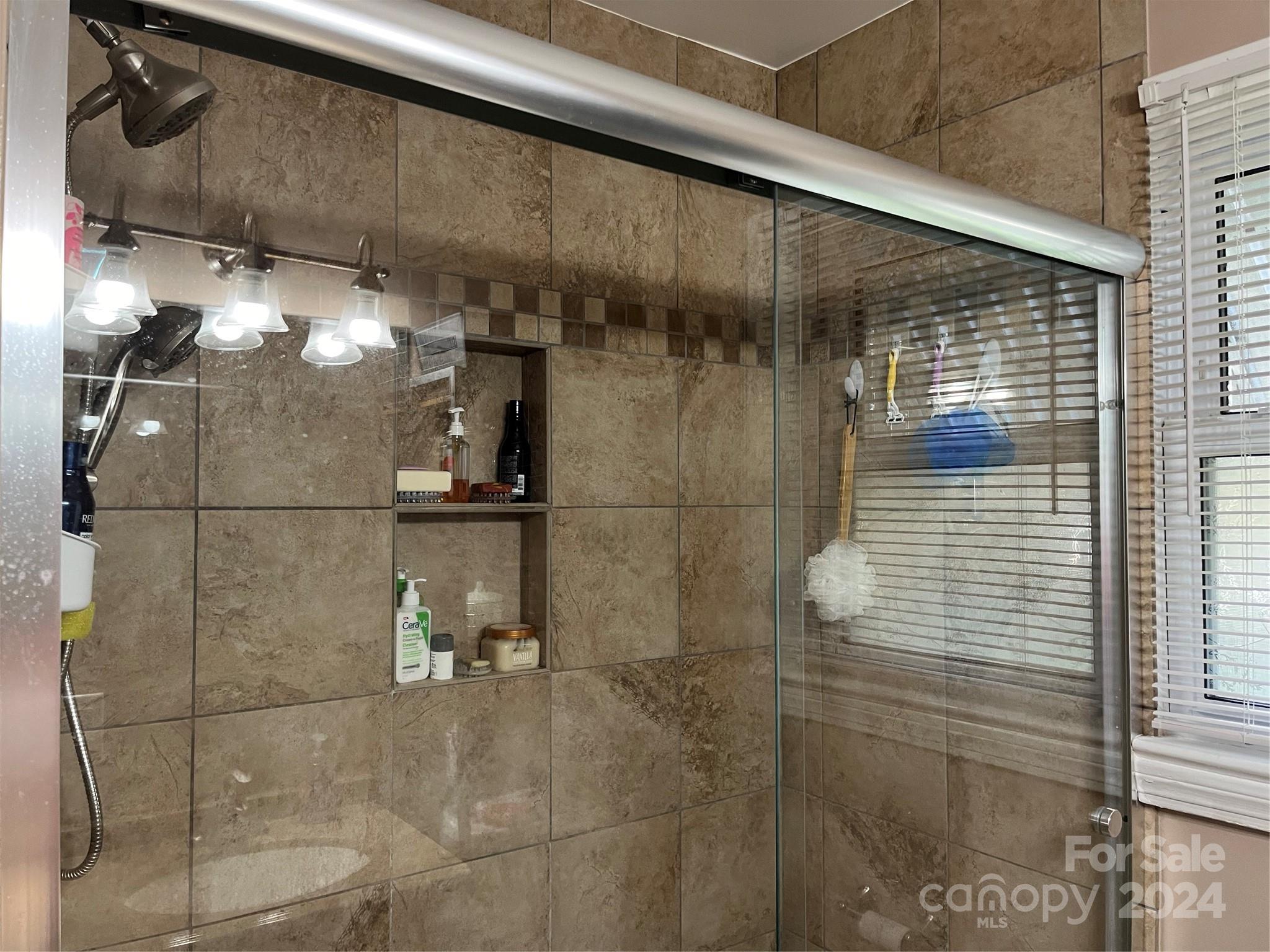 108 North Street Morganton, NC 28655 - Photo 7 of 12 a bathroom with a shower