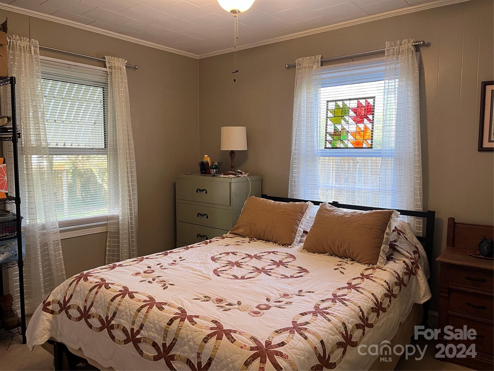 108 North Street Morganton, NC 28655 - Photo 9 of 12 a bedroom with a bed and a window