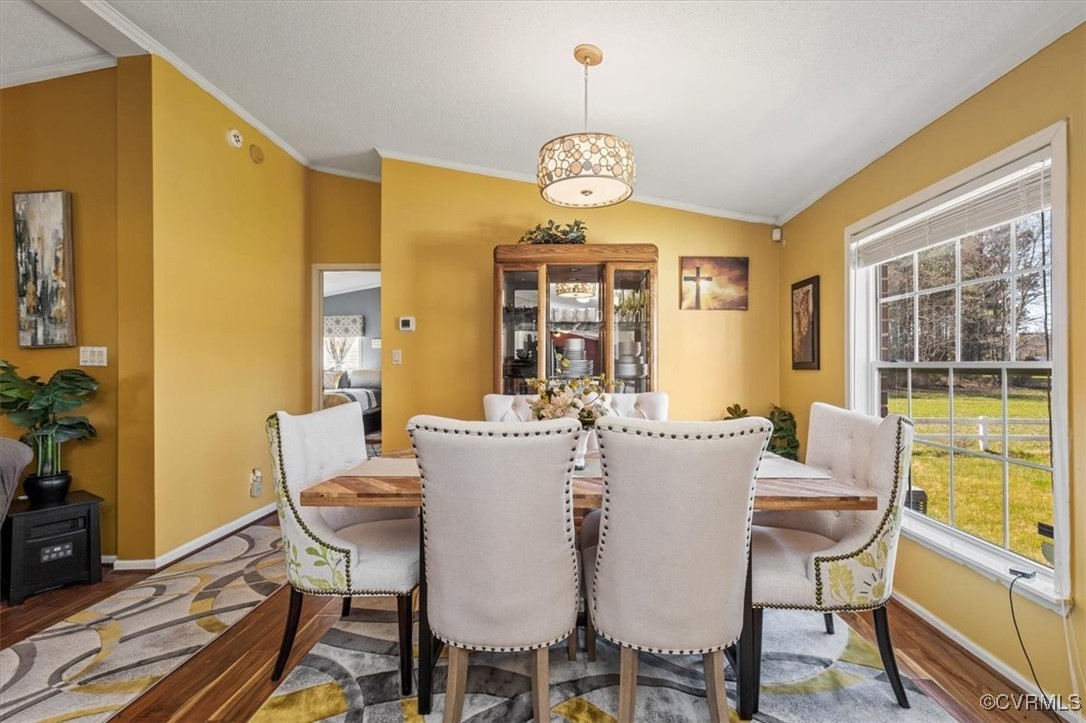 18436 Wakefield Road Courtland, VA 23837 - Photo 11 of 50 Dining area featuring crown molding, baseboards, a