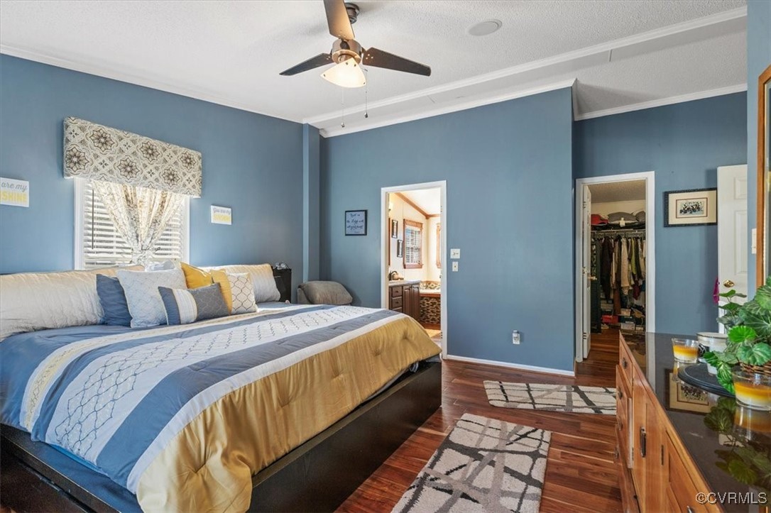 18436 Wakefield Road Courtland, VA 23837 - Photo 17 of 50 Bedroom with a closet, crown molding, a walk in cl