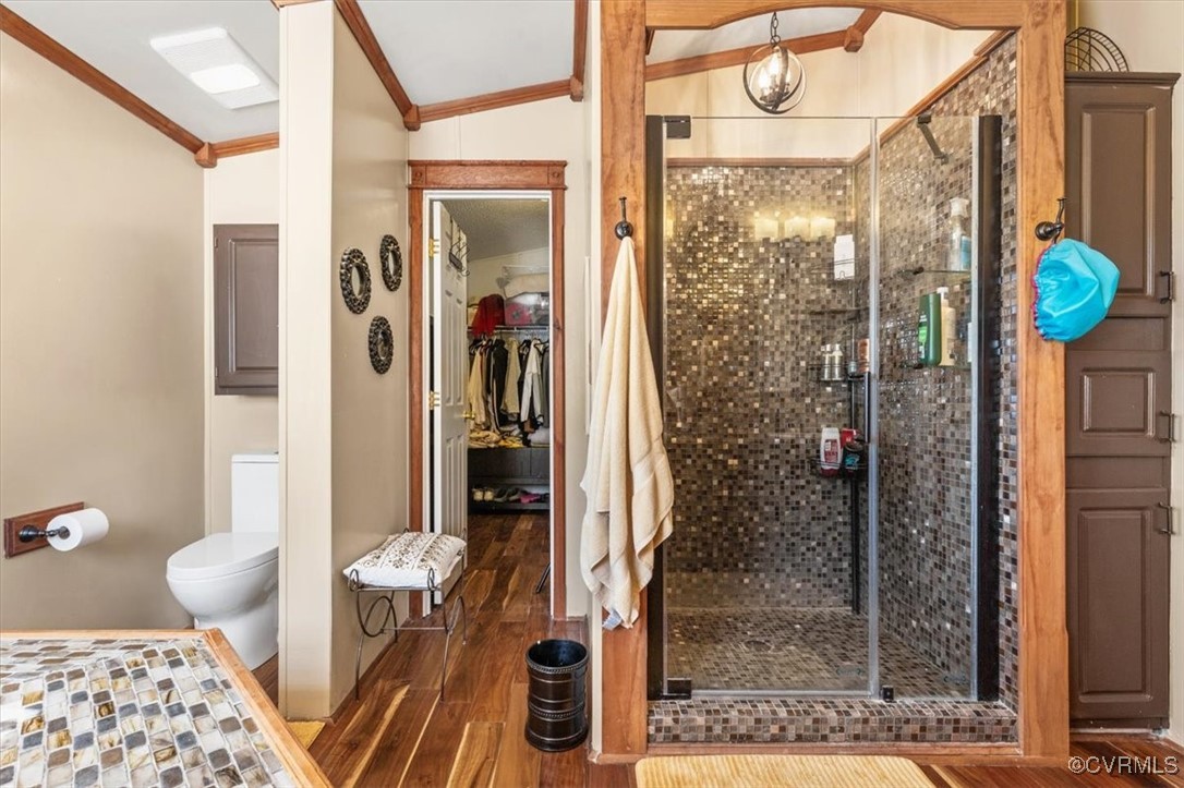 18436 Wakefield Road Courtland, VA 23837 - Photo 20 of 50 Full bathroom with toilet, a shower stall, crown m