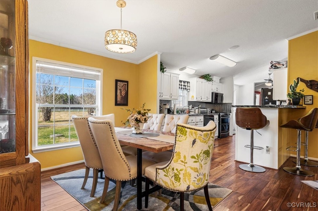 18436 Wakefield Road Courtland, VA 23837 - Photo 23 of 50 Dining room featuring dark wood-type flooring, bas