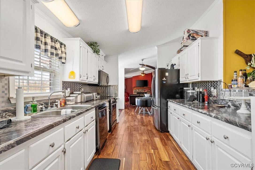 18436 Wakefield Road Courtland, VA 23837 - Photo 25 of 50 Kitchen featuring white cabinetry, ceiling fan, a