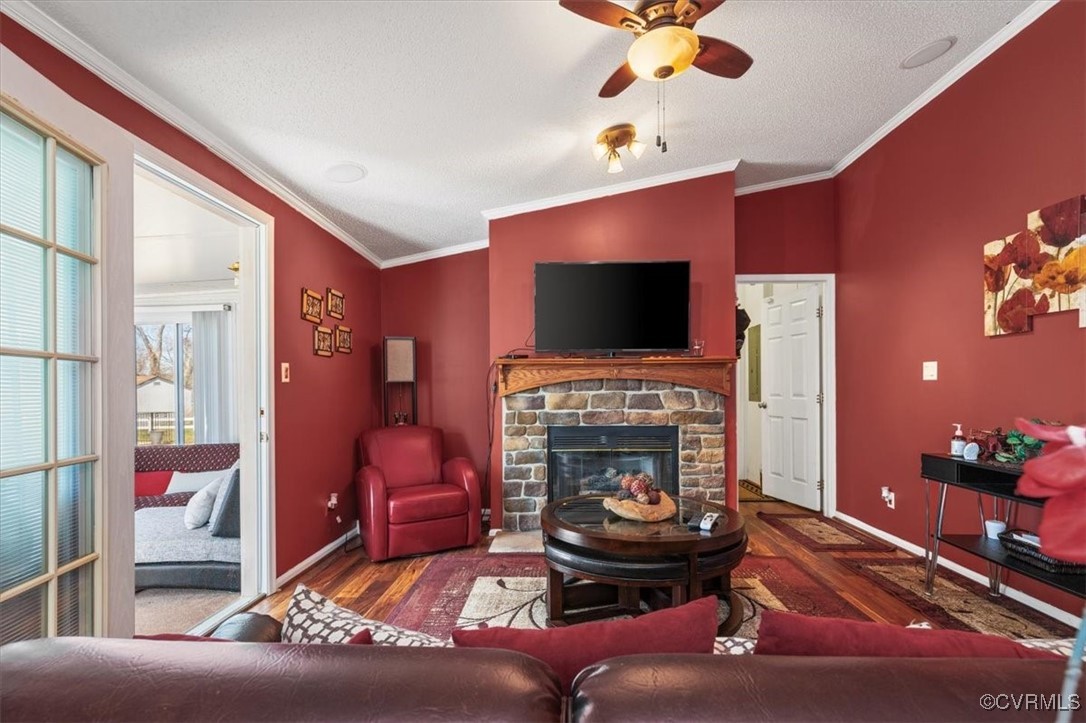18436 Wakefield Road Courtland, VA 23837 - Photo 30 of 50 Living room featuring a fireplace, crown molding,