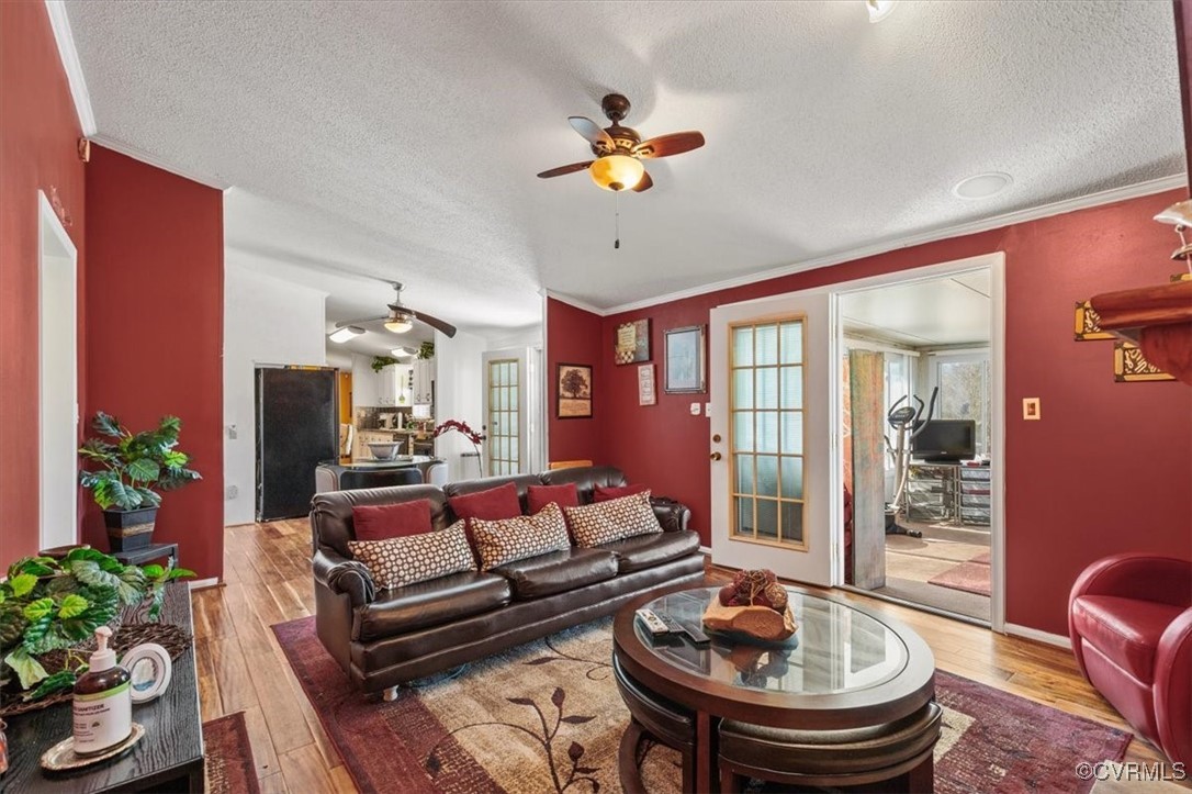 18436 Wakefield Road Courtland, VA 23837 - Photo 31 of 50 Living room featuring crown molding, hardwood / wo