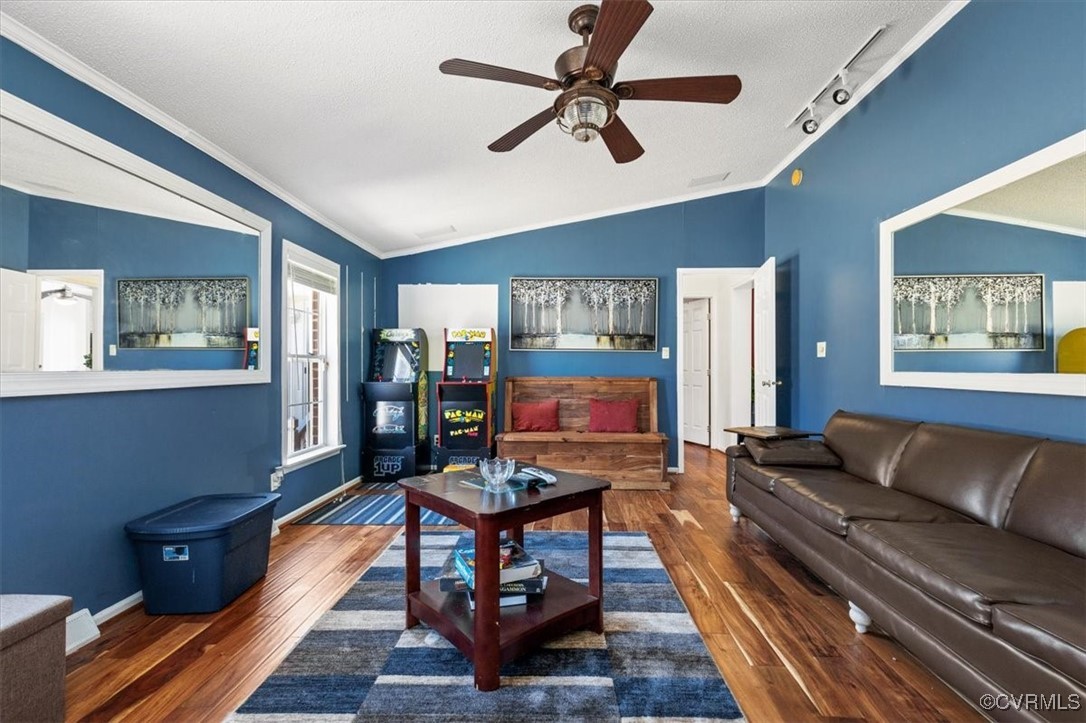 18436 Wakefield Road Courtland, VA 23837 - Photo 37 of 50 Living area featuring crown molding, baseboards, c