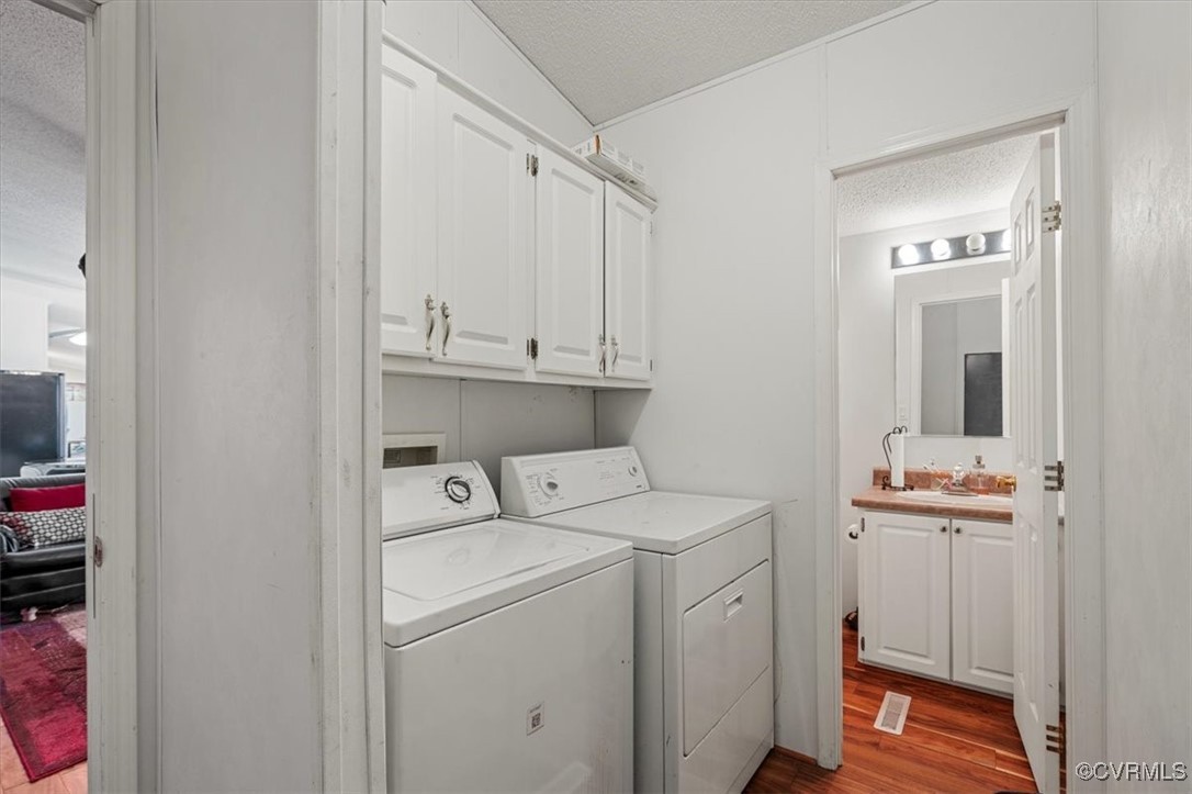 18436 Wakefield Road Courtland, VA 23837 - Photo 41 of 50 Laundry room featuring a textured ceiling, a sink,