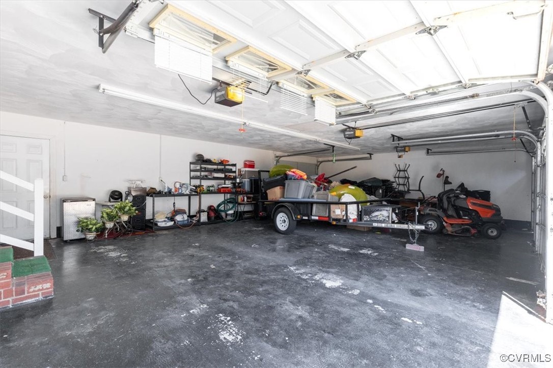 18436 Wakefield Road Courtland, VA 23837 - Photo 44 of 50 Garage featuring a garage door opener