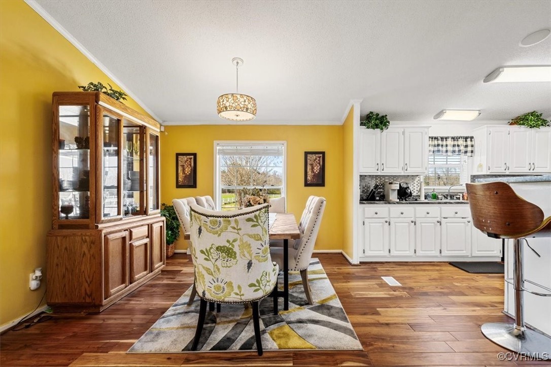 18436 Wakefield Road Courtland, VA 23837 - Photo 10 of 50 Dining area with dark wood-style flooring, ornamen
