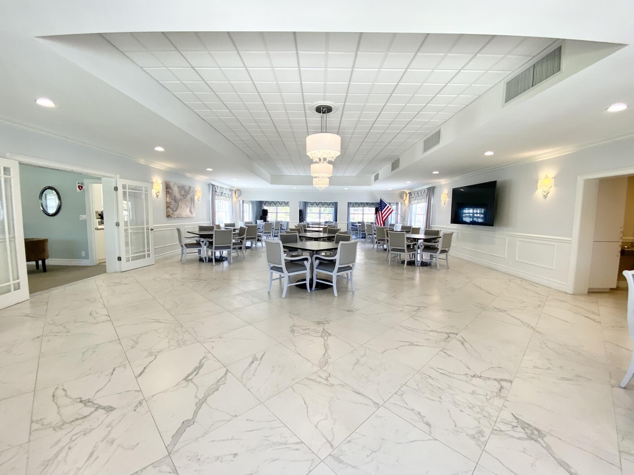 2871 North Ocean Boulevard, Unit V443 Boca Raton, FL 33431 - Photo 32 of 49 a living room with lots of furniture a chandelier