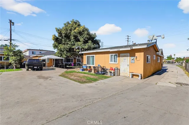 a view of house with outdoor space and parking
