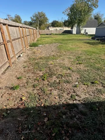 a view of a field with an ocean