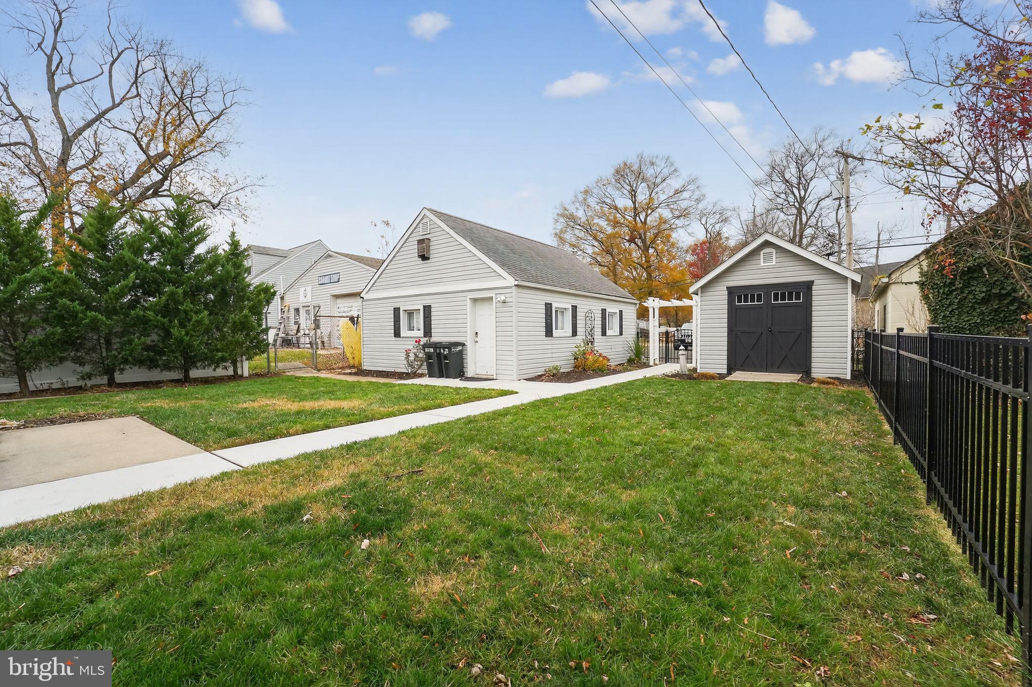 920 Seneca Park Road Middle River, MD 21220 - Photo 14 of 60 a front view of a house with yard and green space